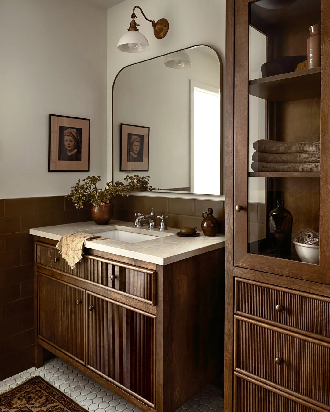 Earthy Bathroom with Wood Vanity and Sconce Lighting