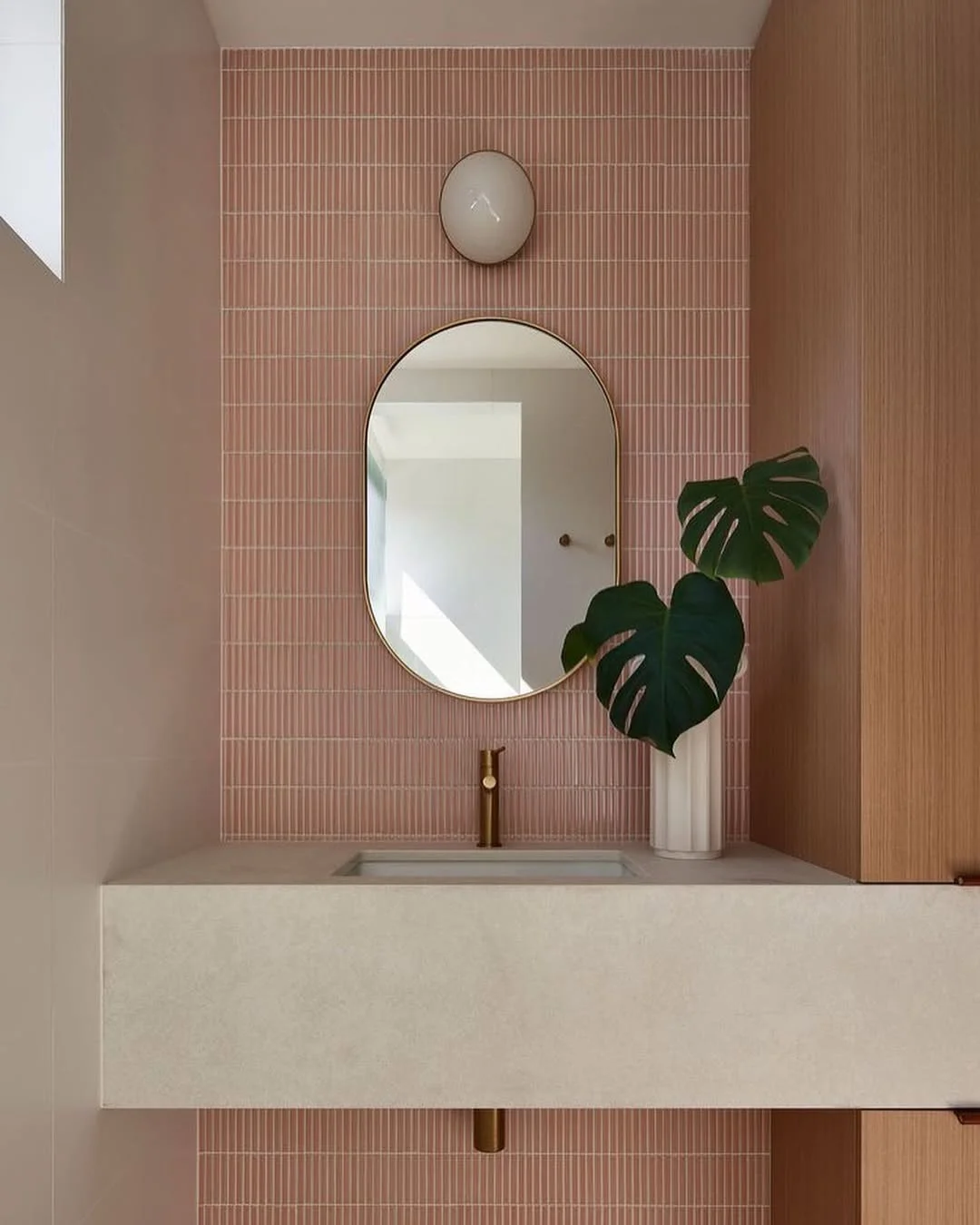 Minimalist Bathroom with Pink Kit Kat Tile and Oval Mirror