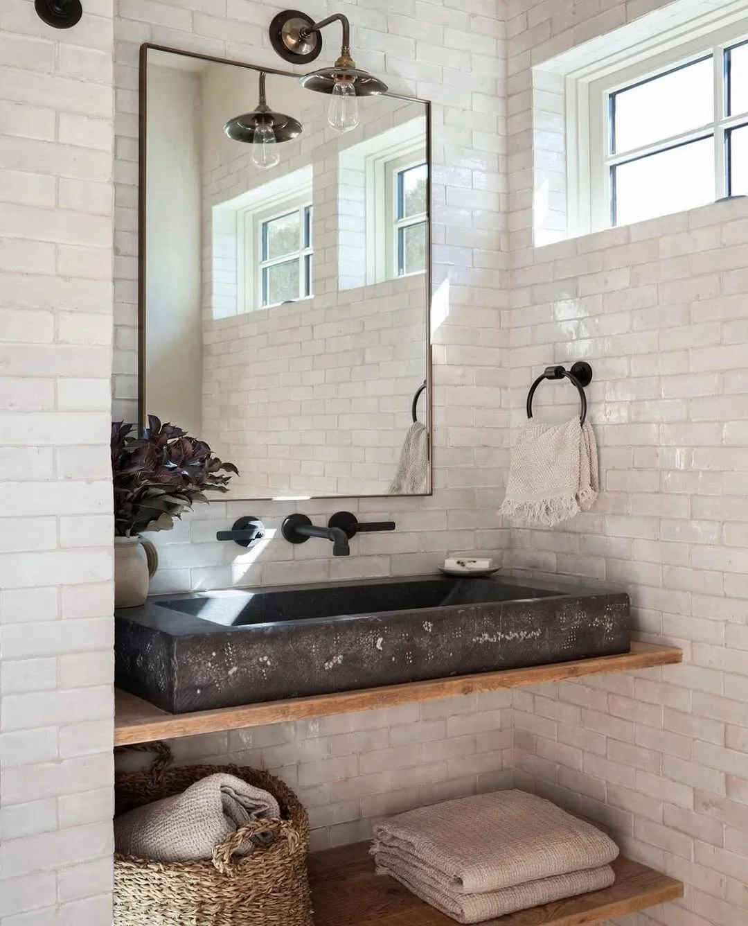 Modern Farmhouse Bathroom with Industrial Sconces and Metal Framed Mirror