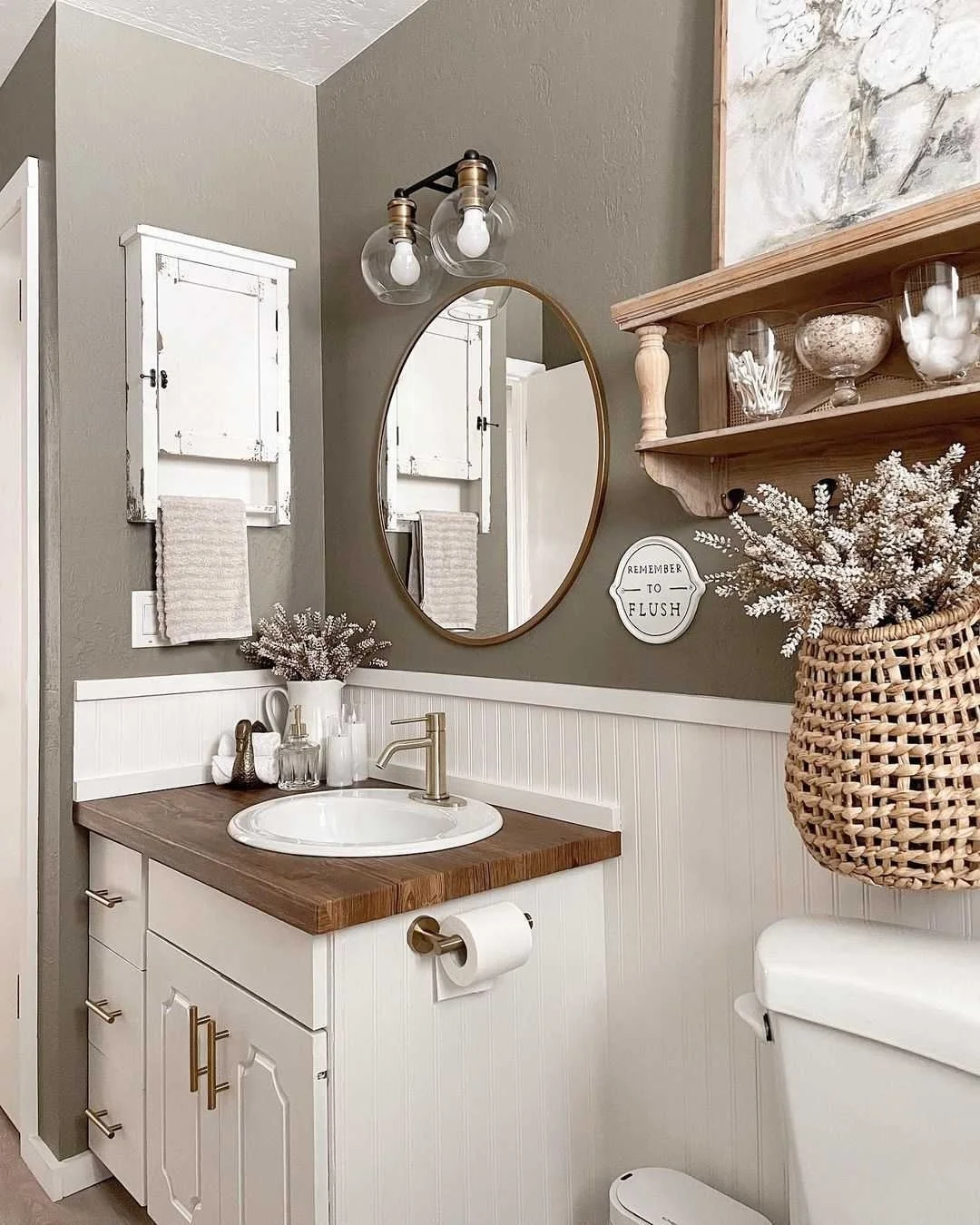 Farmhouse Bathroom with Globe Light Vanity and Round Mirror