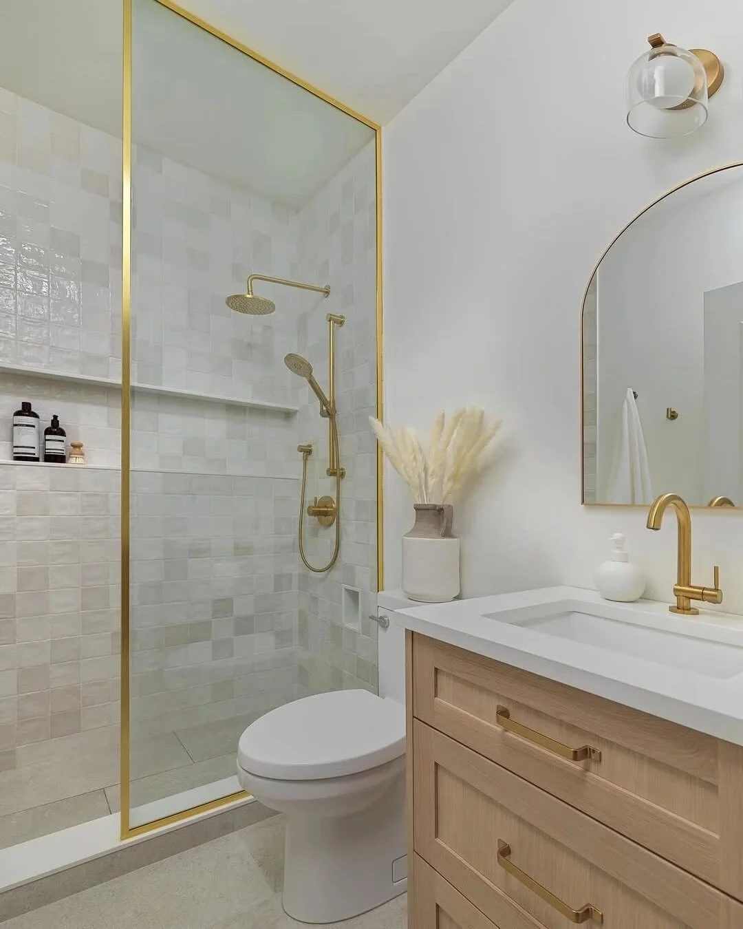 Small Bathroom with Gold Accents and Shower Lighting