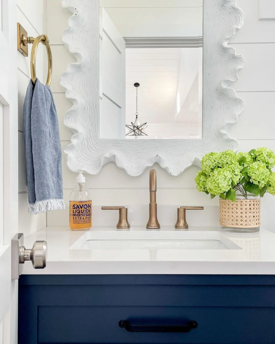 Coastal Bathroom with Scalloped Mirror