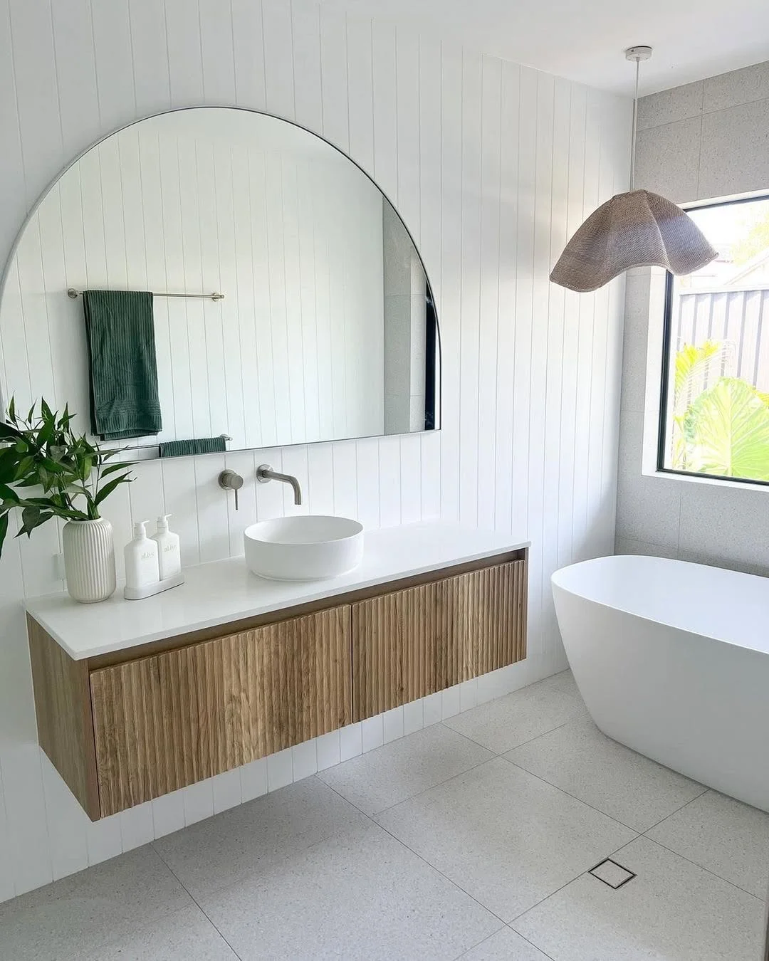 Modern Bathroom with Arched Mirror