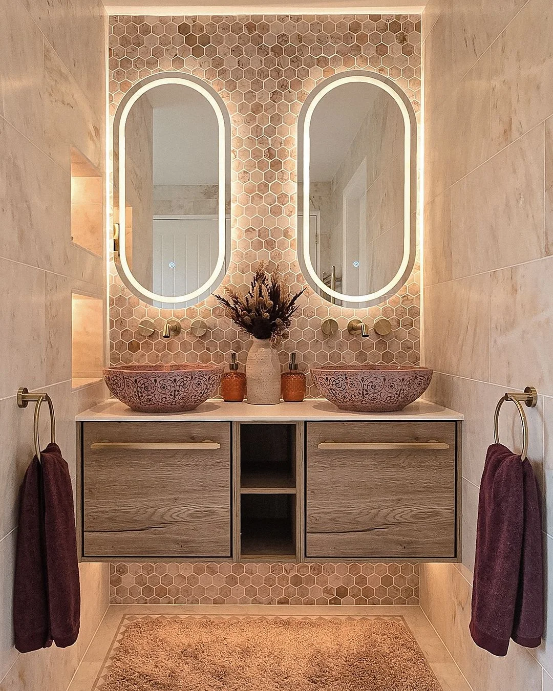 Boho Bathroom with Oval Lighted Mirrors