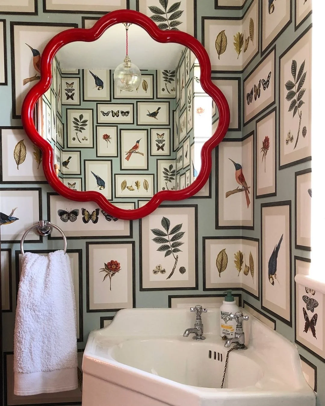 Whimsical Bathroom with Red Scalloped Mirror