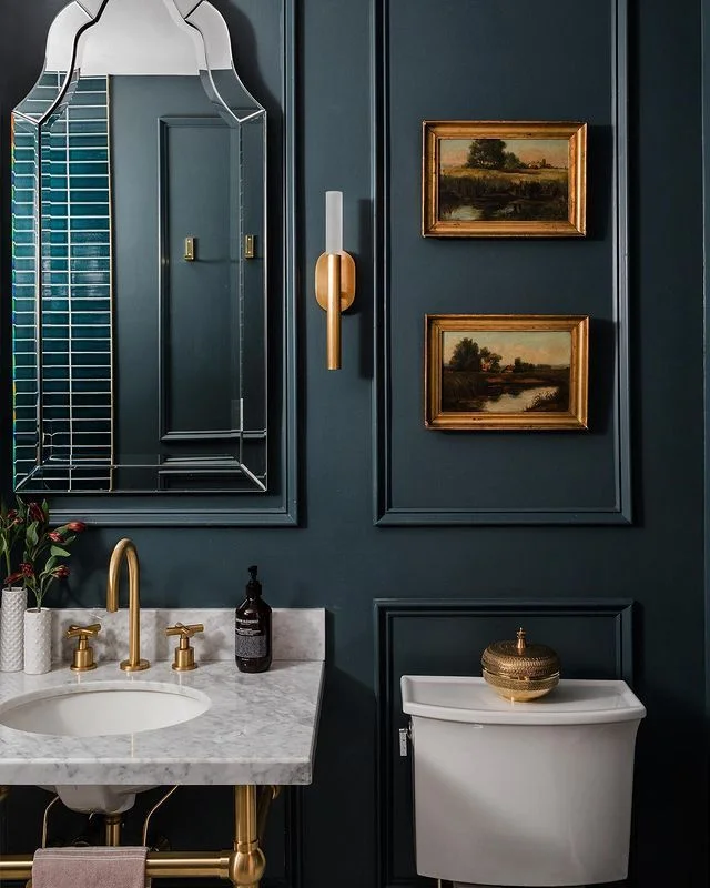 Vintage Art and Luxurious Fixtures for an Elegant Bathroom