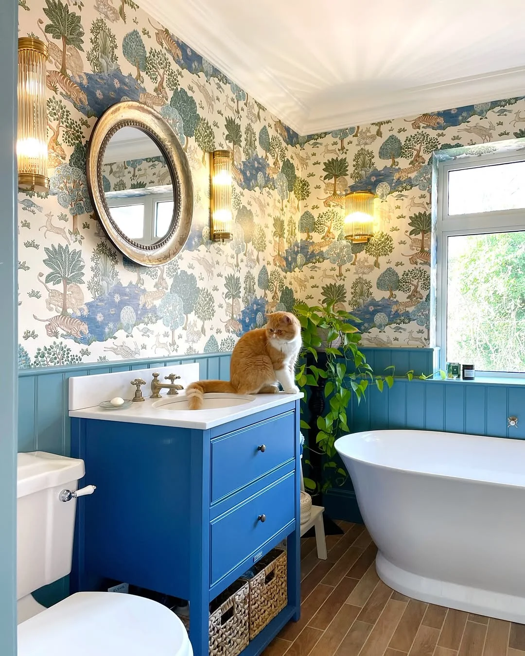 Blue Bathroom with Whimsical Animal Wallpaper