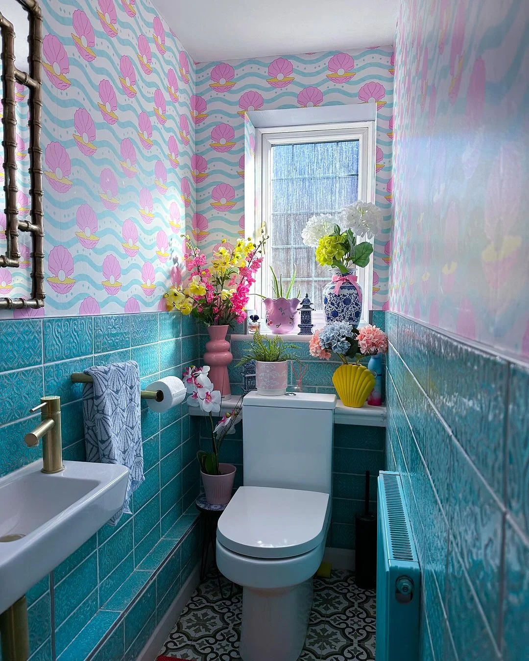 Playful Teal and Pink Bathroom with Seashell Wallpaper