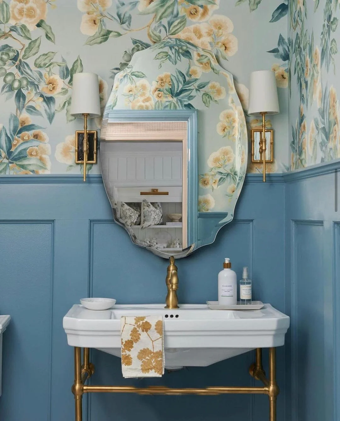 Blue Bathroom with Floral Wallpaper and Scalloped Mirror