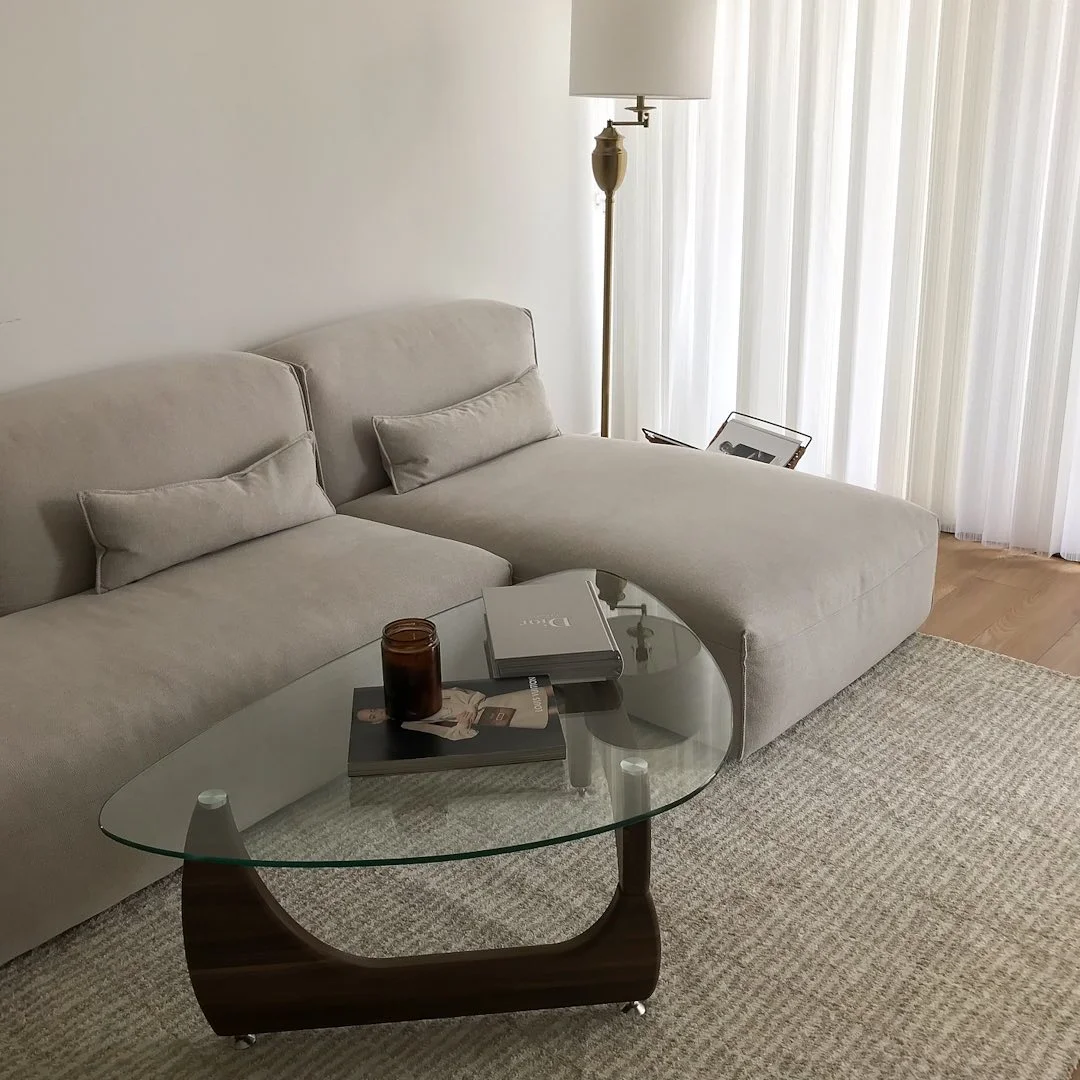 Minimalist Beige Living Room with Glass Coffee Table