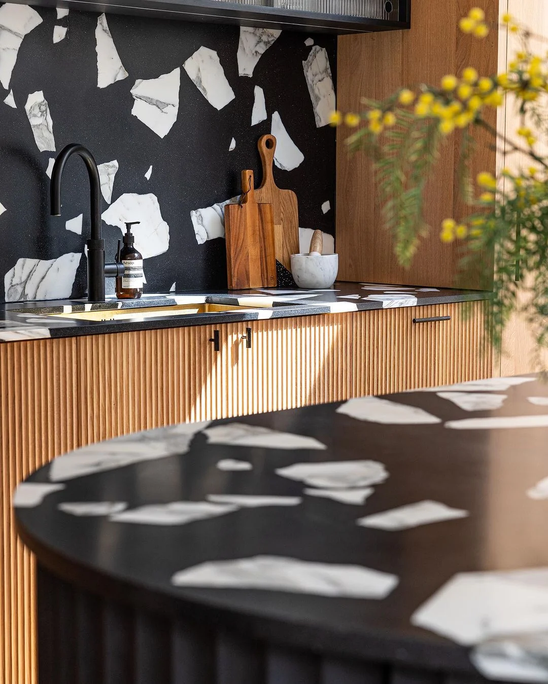 Playful Contrast: Terrazzo and Oak Kitchen