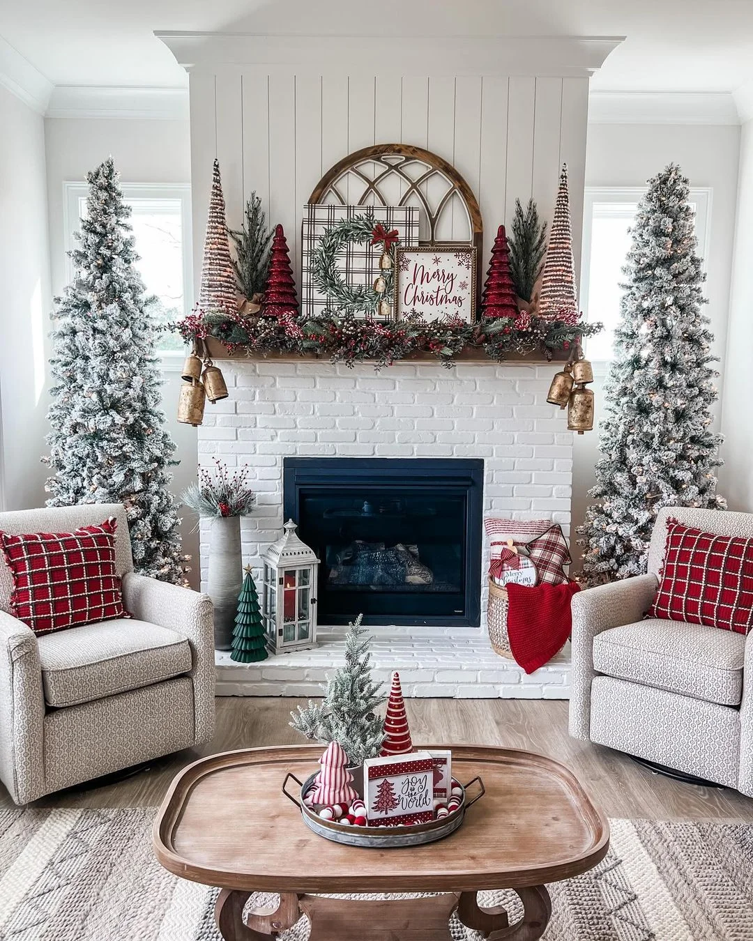 A Mantel with Red Accents and Frosted Trees