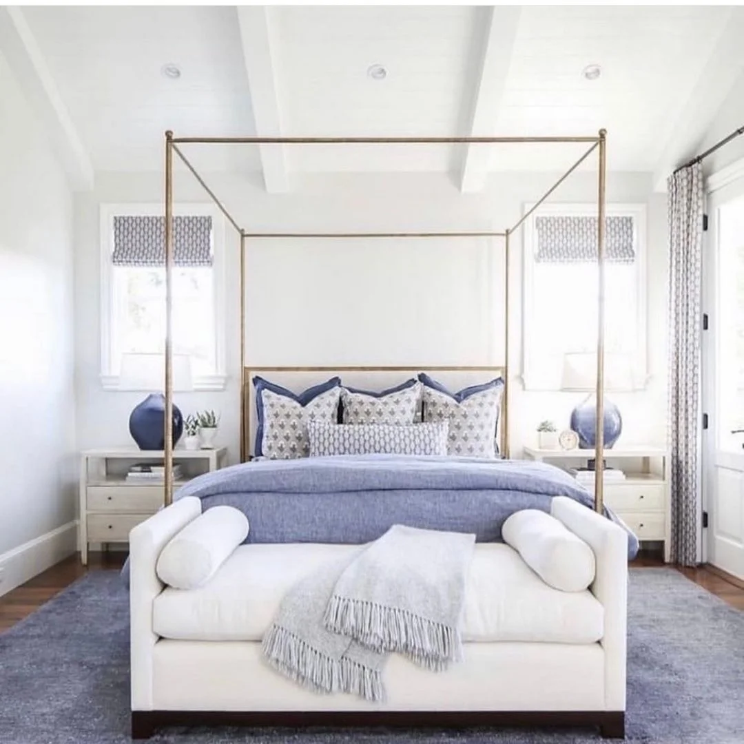 A Bold Four-Poster Bed with Coastal Blue Accents