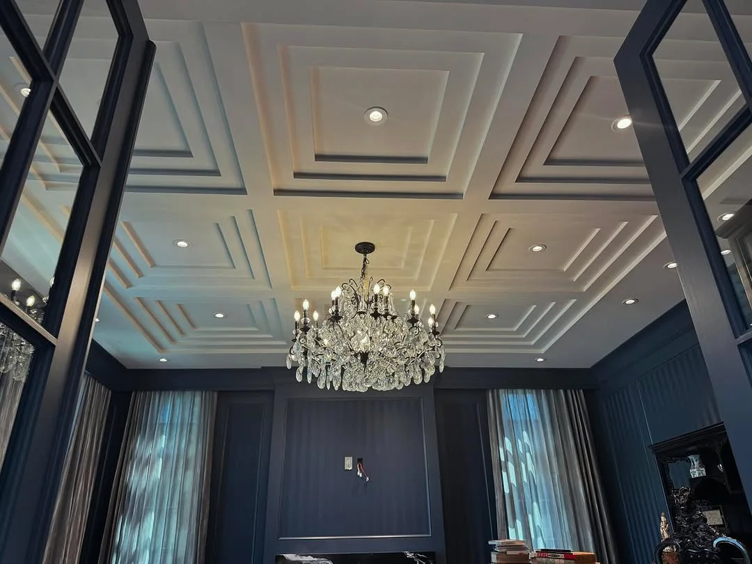 Modern Room with Geometric Coffered Ceiling and Crystal Chandelier