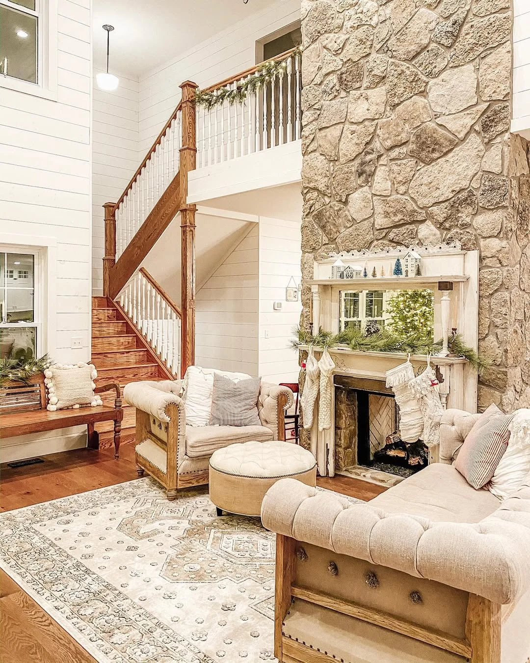 Farmhouse Living Room with Stone Fireplace