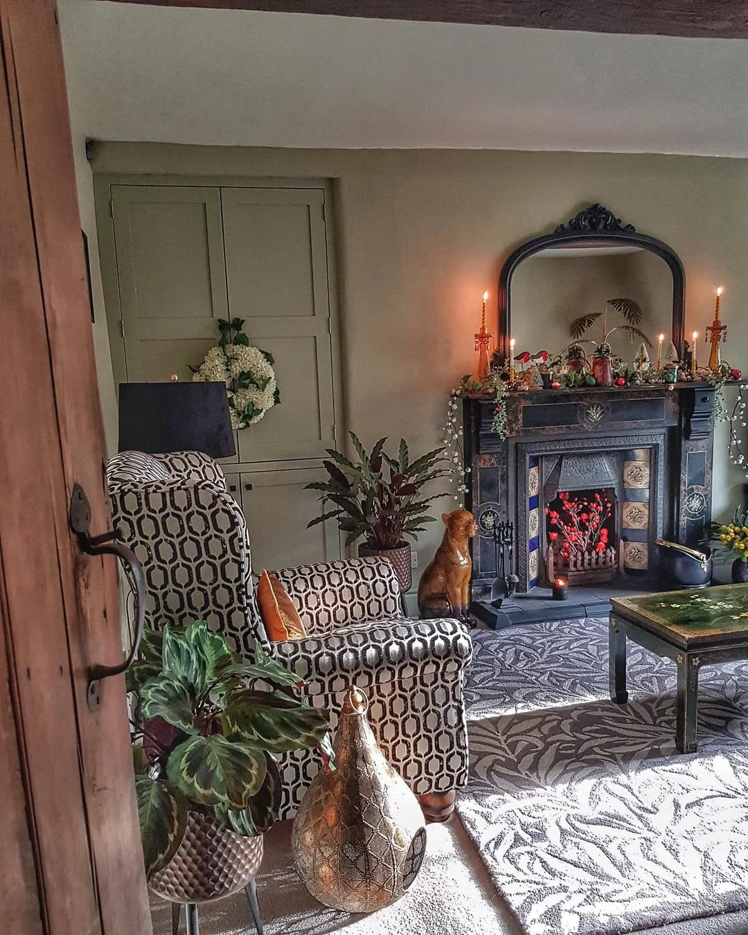 Eclectic Cottage Living Room with Ornate Fireplace