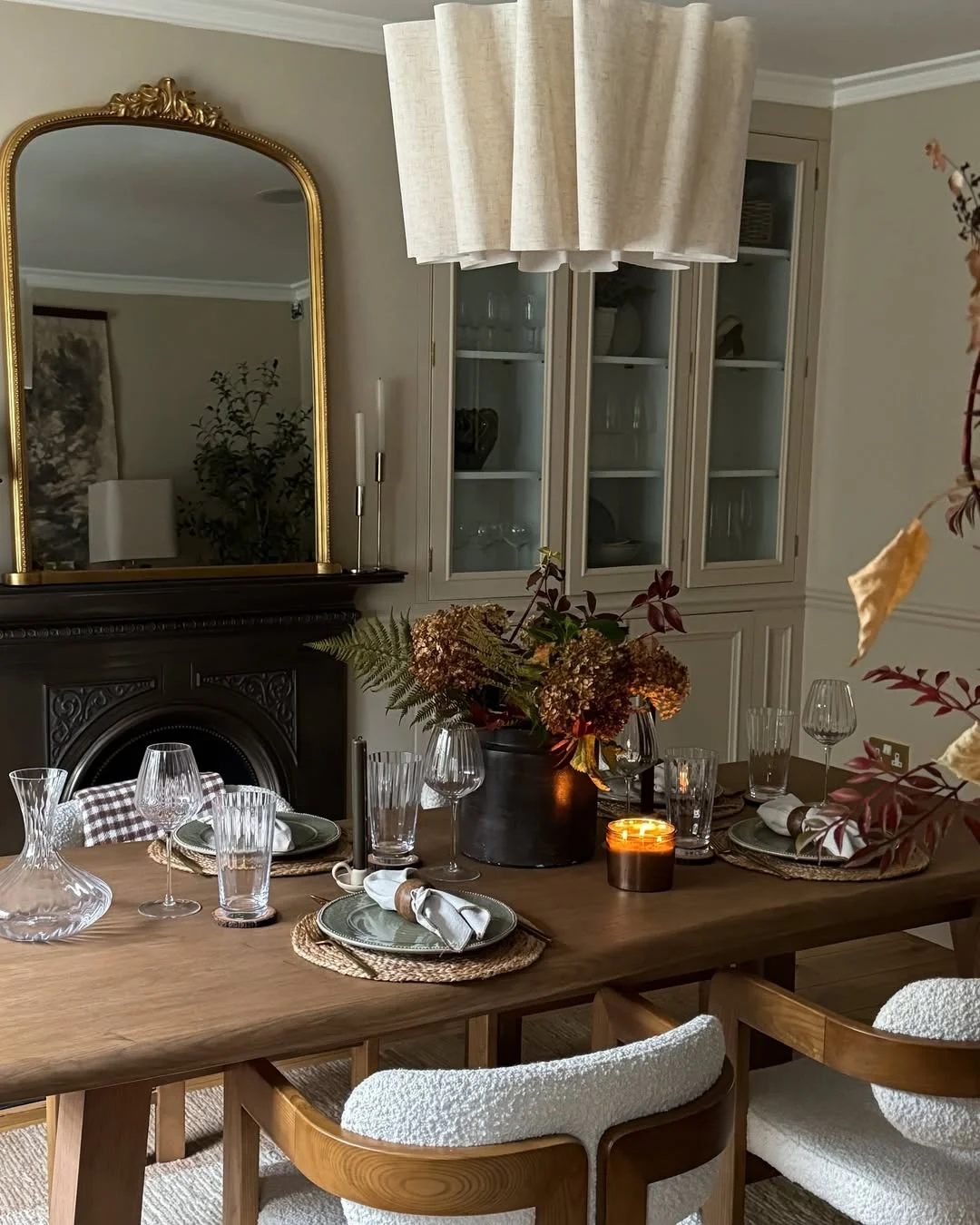 Cozy Autumnal Dining Room with Ornate Gold Mirror