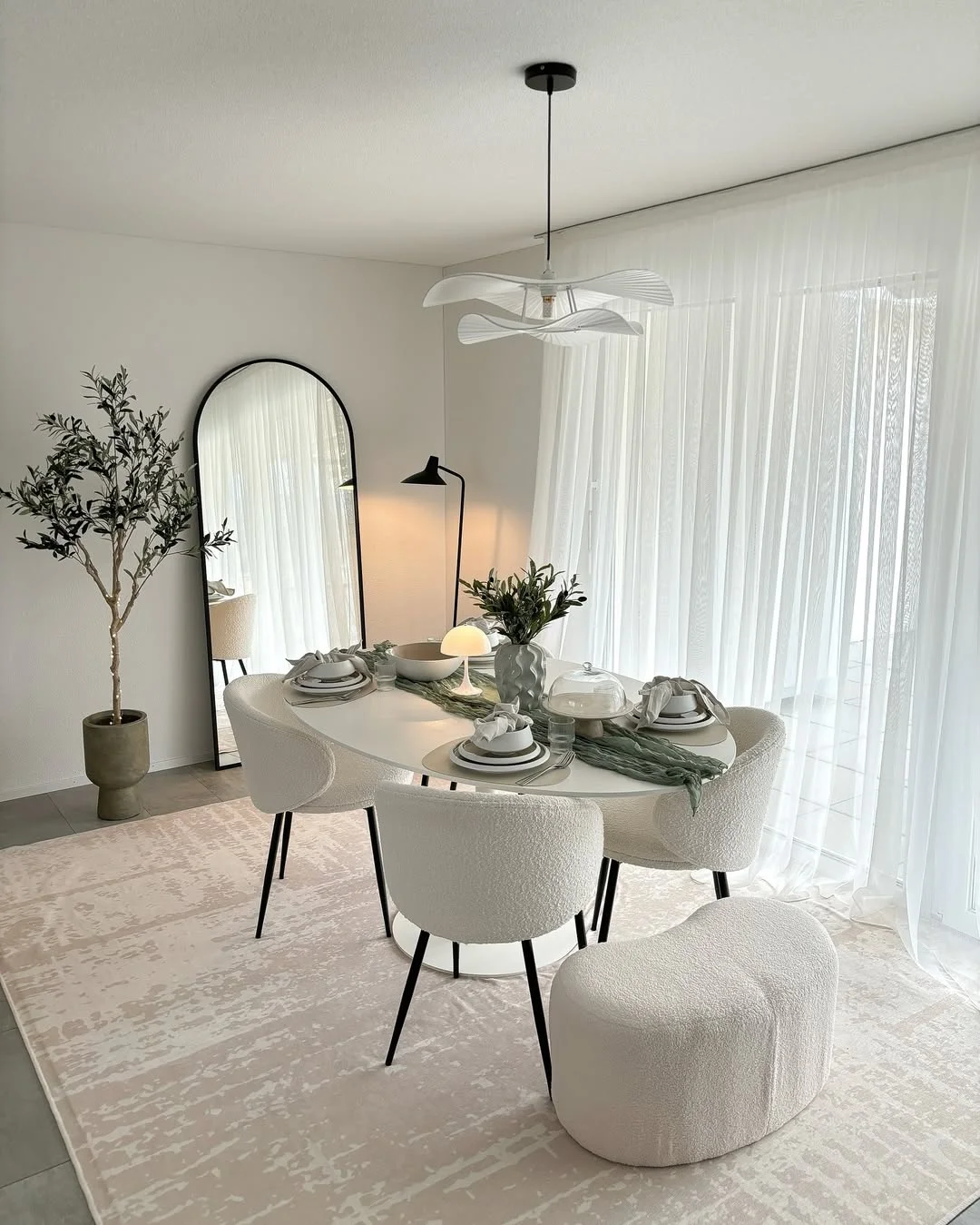 Minimalist Chic Dining Room with Arched Mirror