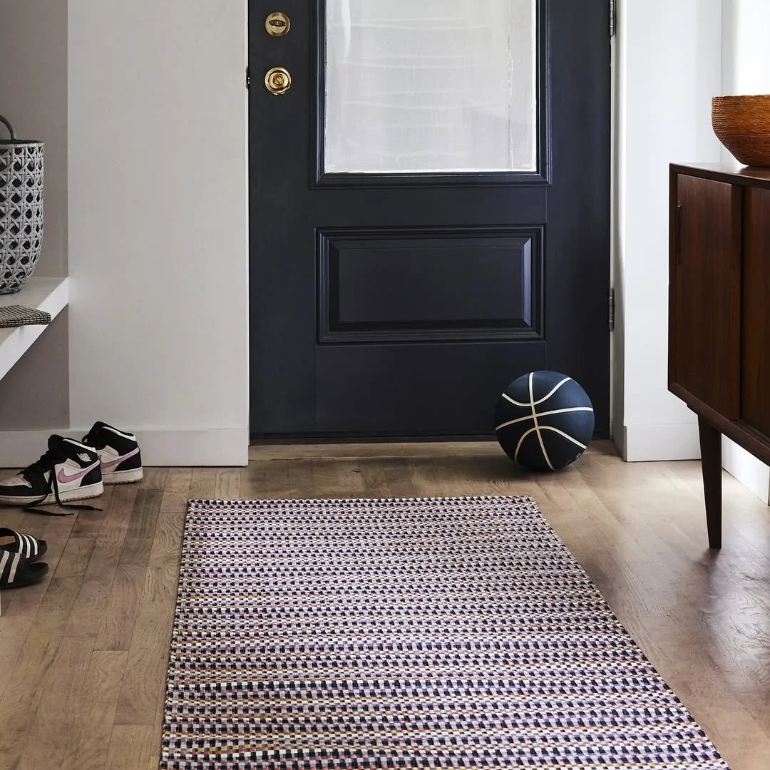 Minimal Entryway with Colorful Woven Rug