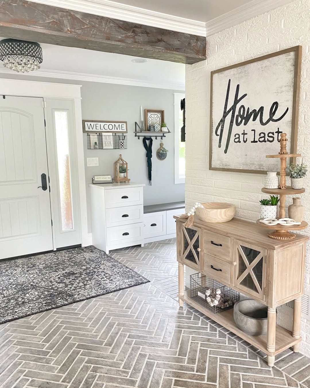 Farmhouse Entryway with Herringbone Tile and Distressed Beam