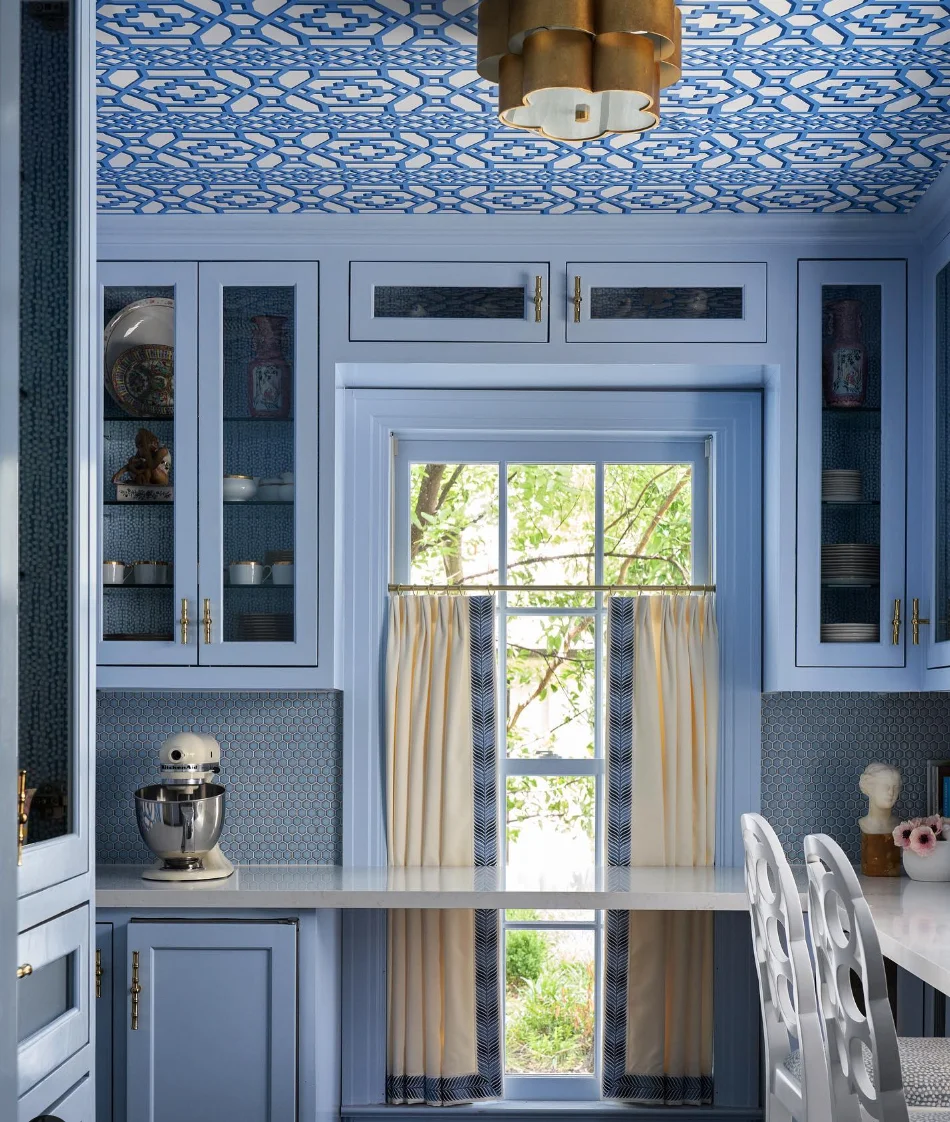 L-Shaped Layout with Large Window &amp; Soft Blue Cabinets