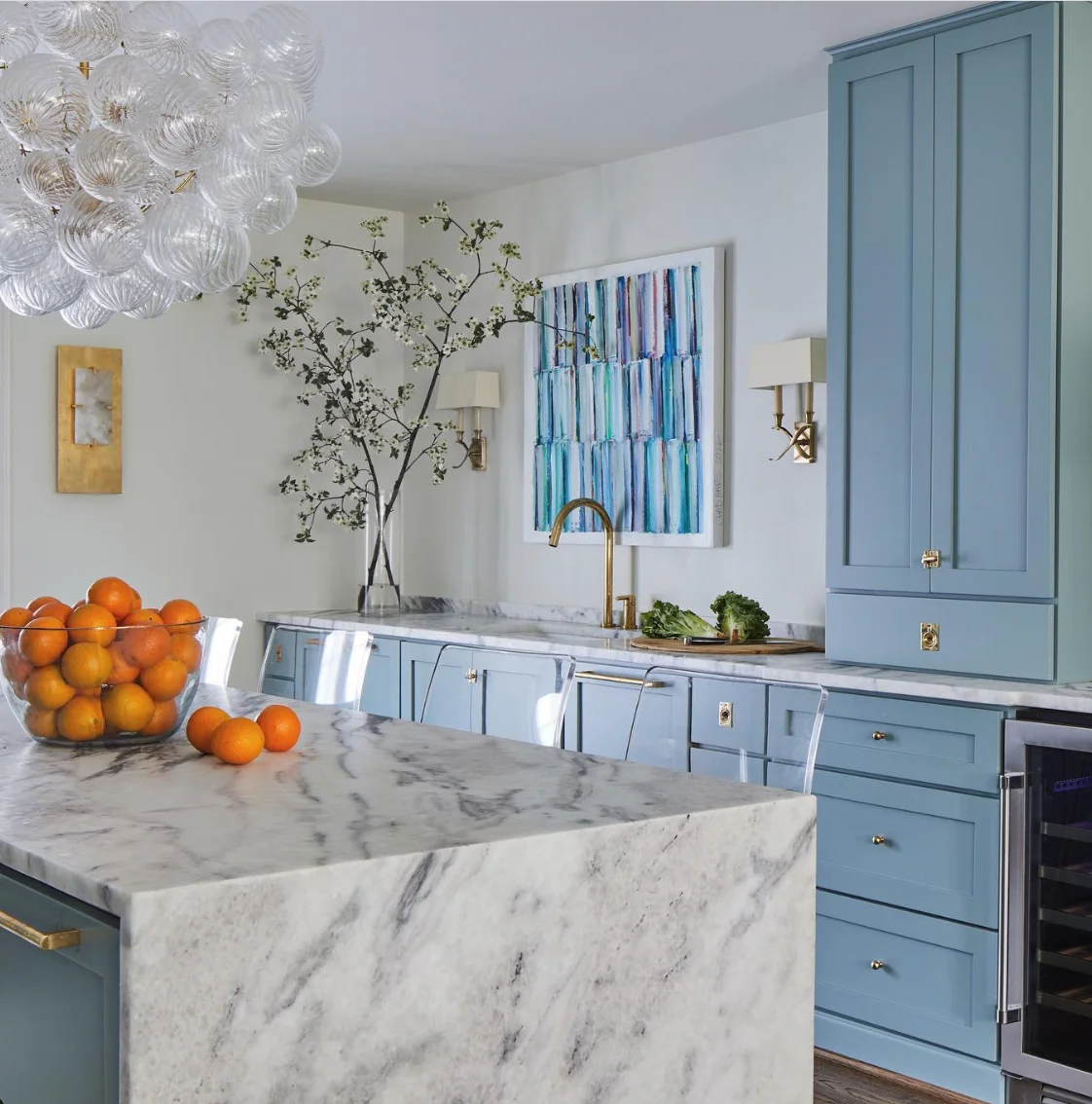 Light Blue Cabinets Paired with Marble Elegance