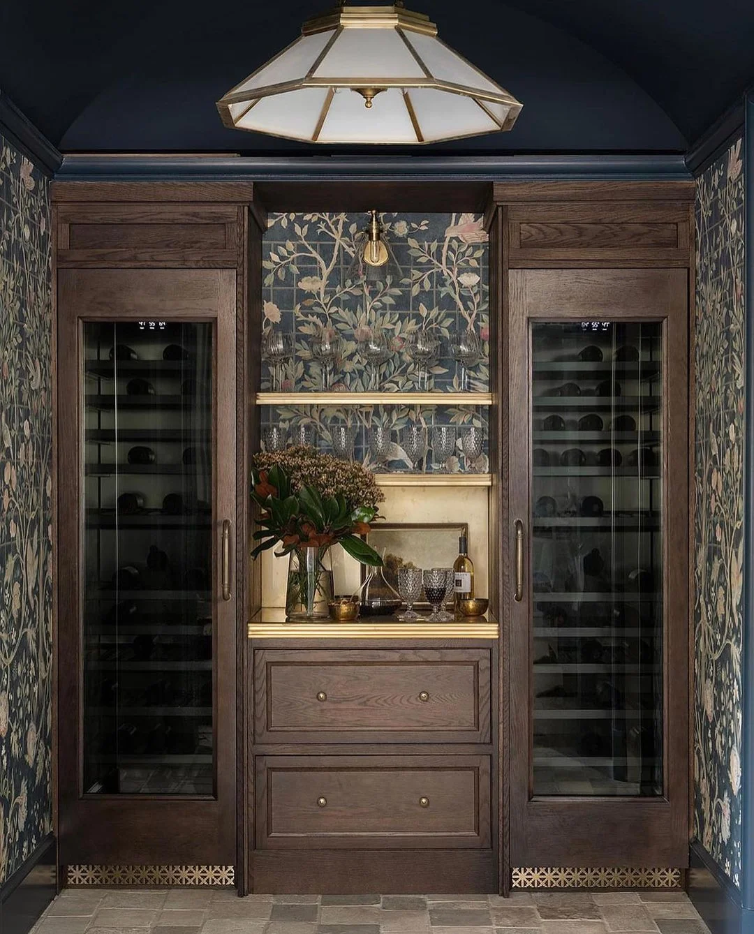 Dark Wood Cabinets with Gold Details and a Floral Backsplash