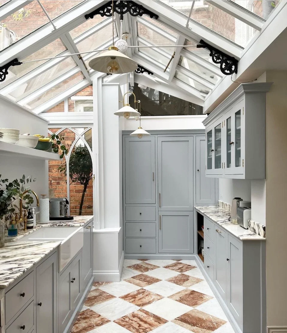 Unique Kitchen with a Glass Ceiling and Striking Blue Cabinets