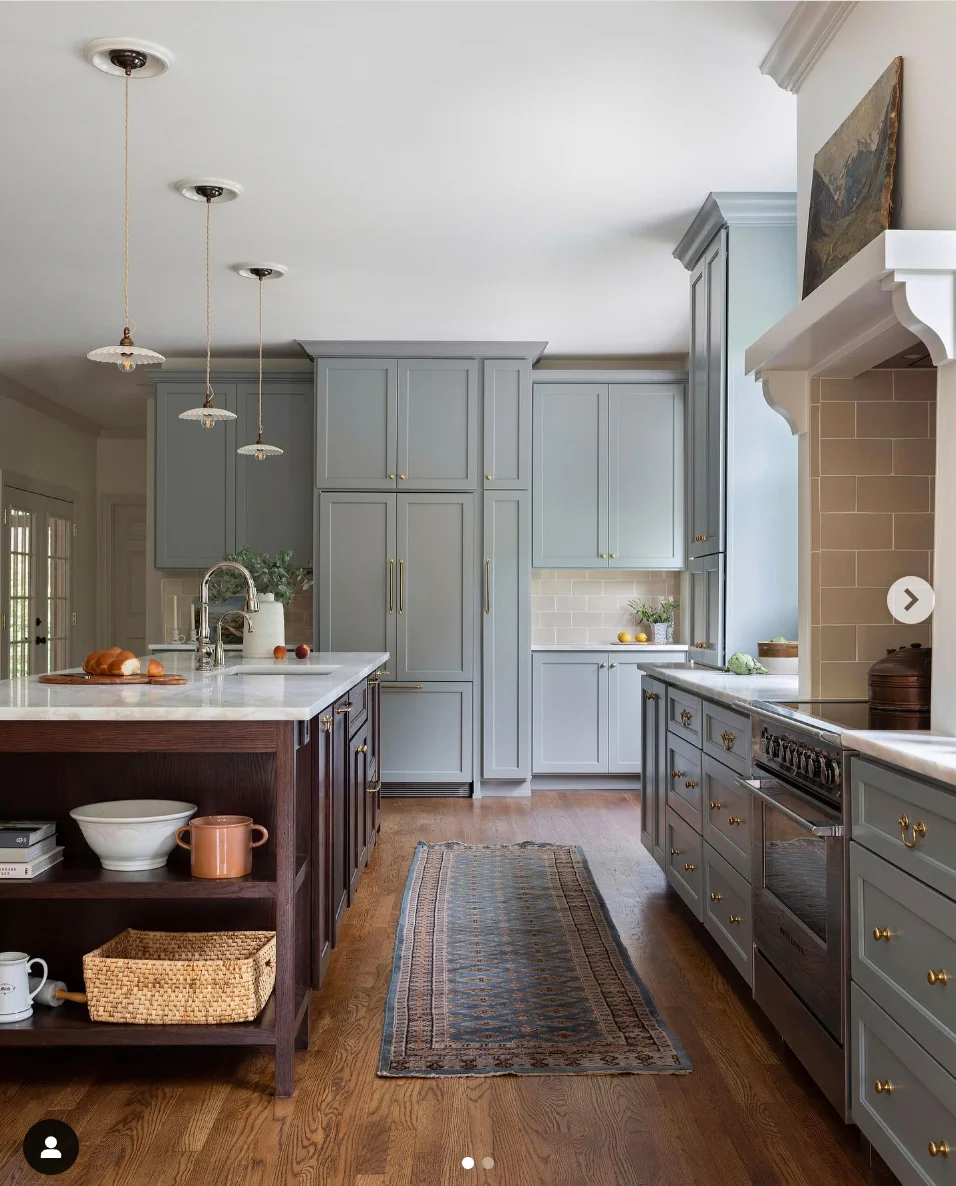 Serene Blue Shaker Cabinets with Rich Wood Floors