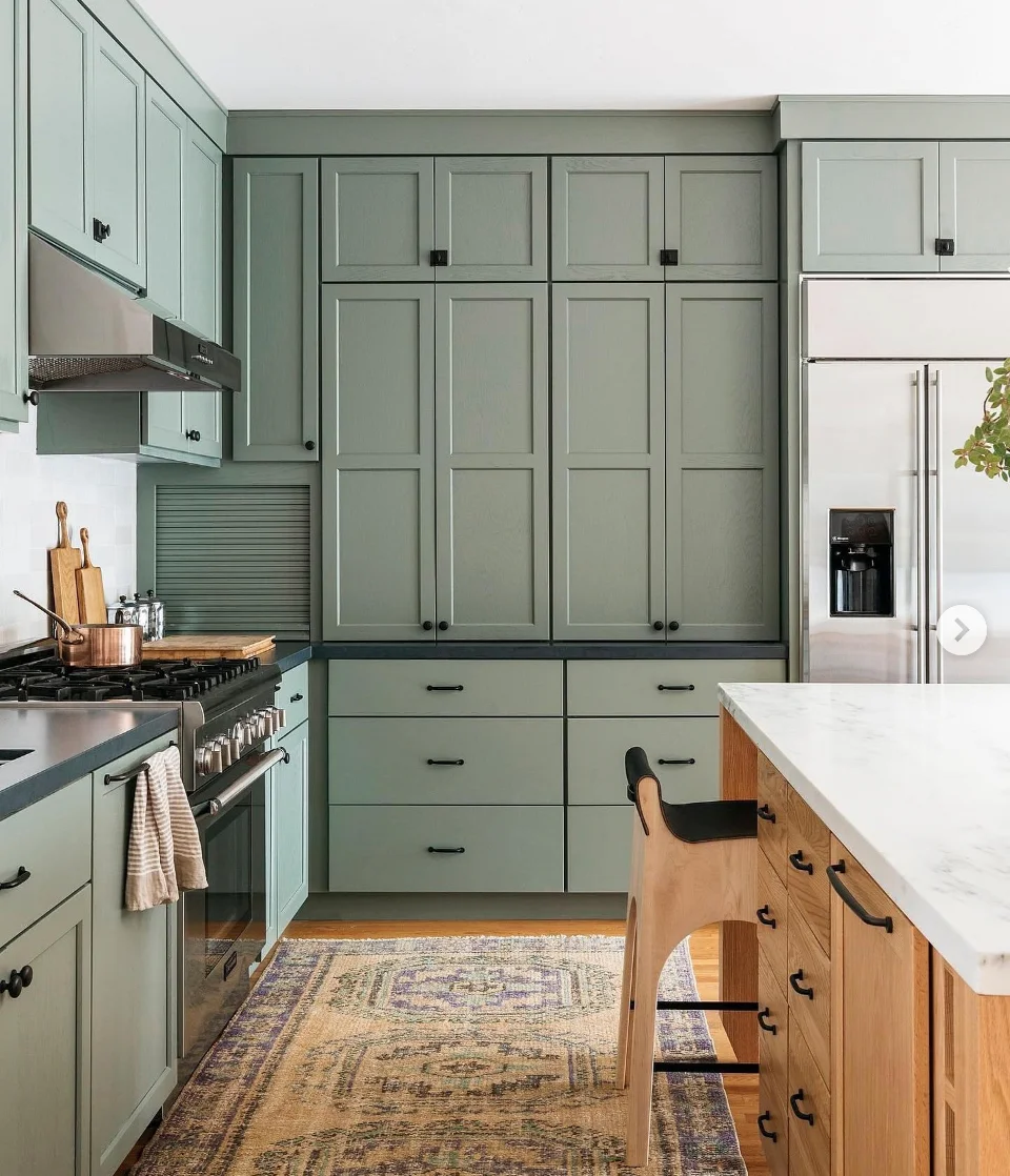 Soothing Sage Cabinets with Bold Black Accents