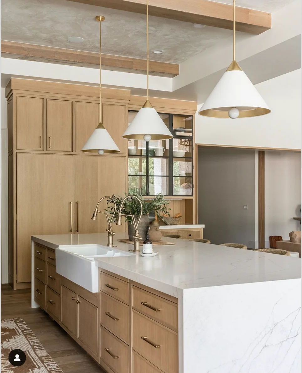 Warm Wood Cabinets with White Countertops and Thoughtful Lighting