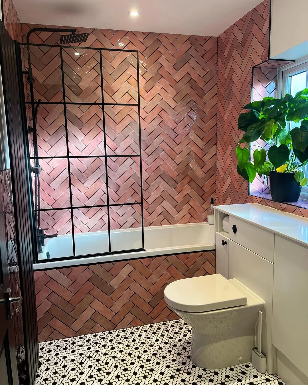 Pink Herringbone Bathroom with a Retro Touch