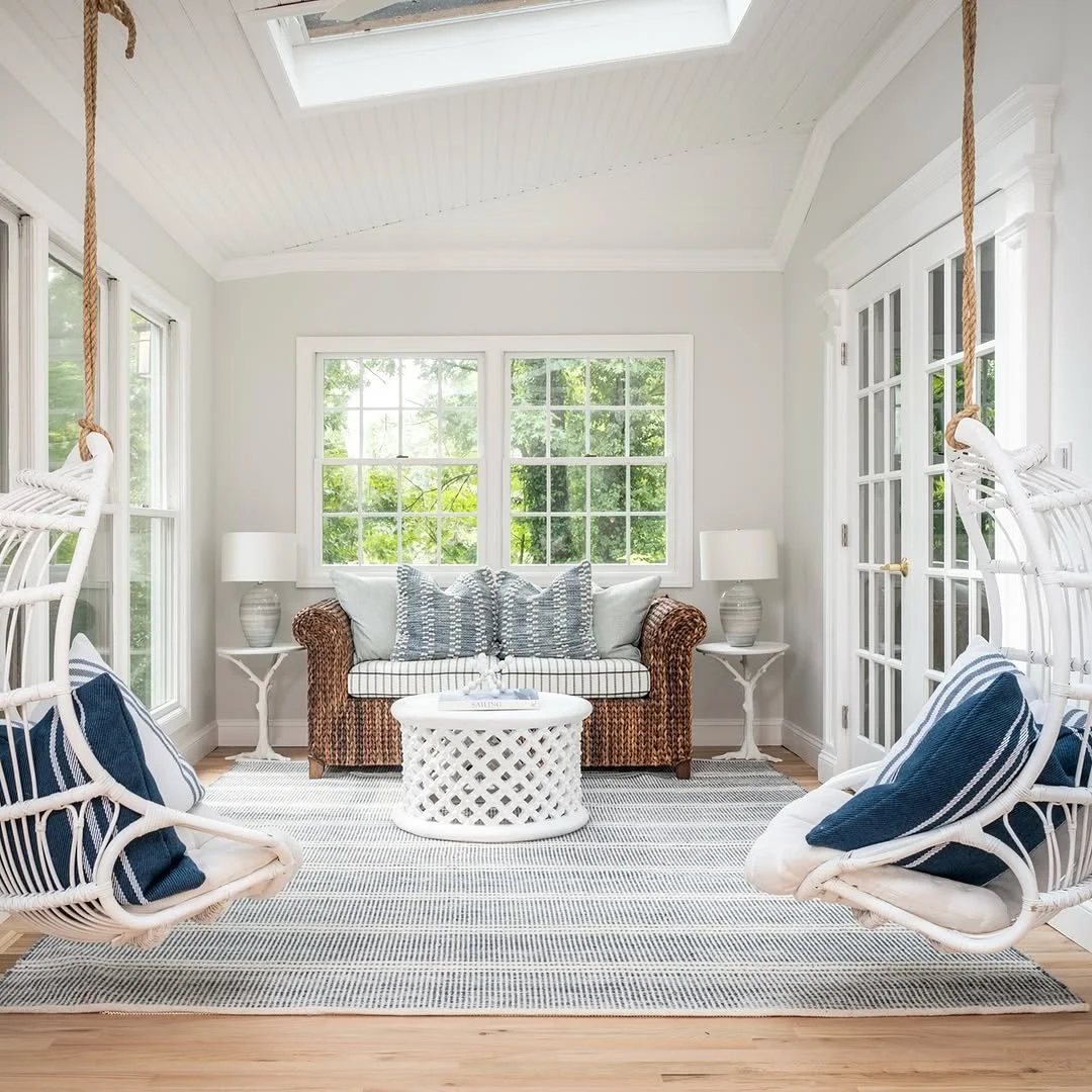 Breezy Sunroom with Hanging Chairs