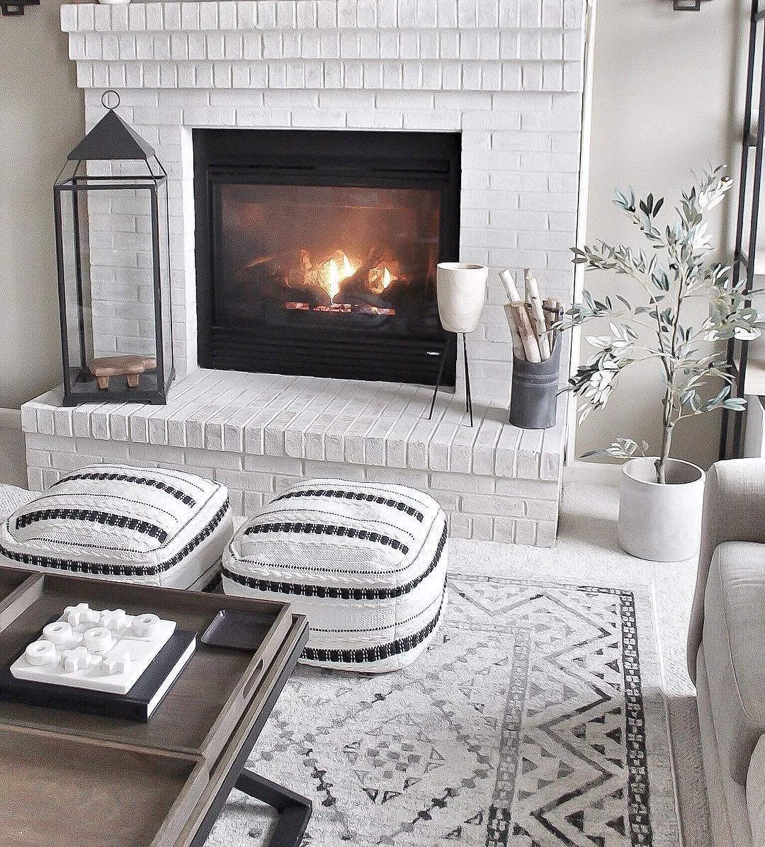 Modern Lime Brick Fireplace with Black Accents