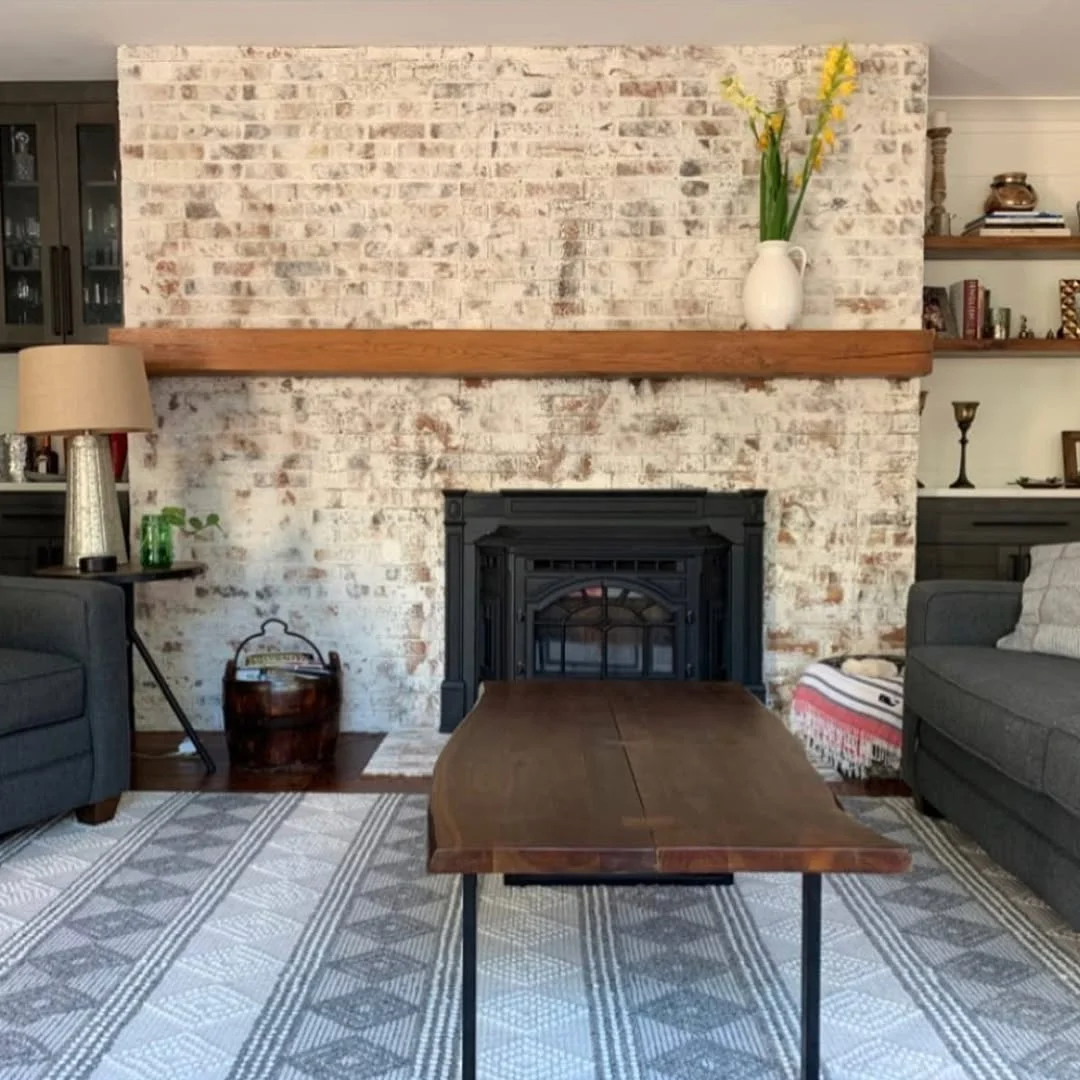 Limewashed Brick Fireplace with Live Edge Coffee Table