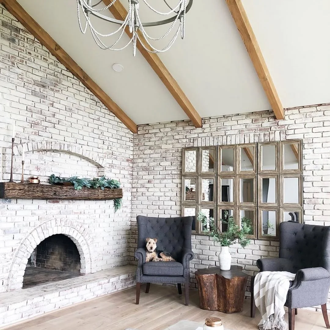 Limewashed Brick Fireplace with Vaulted Ceiling