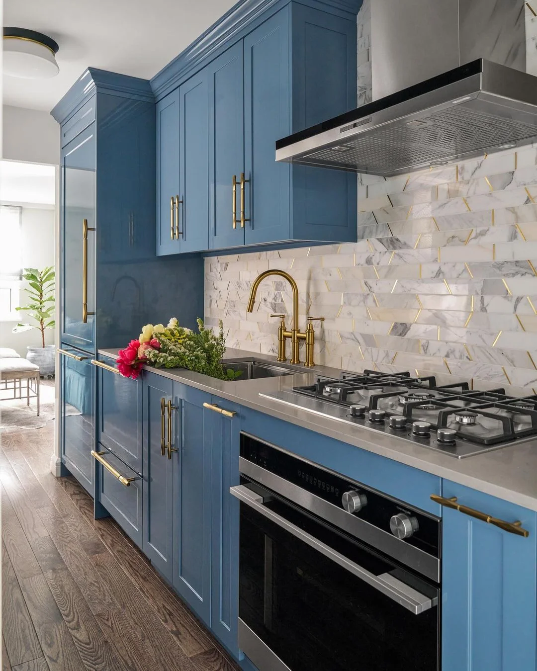 Blue Cabinets with Geometric Marble Details