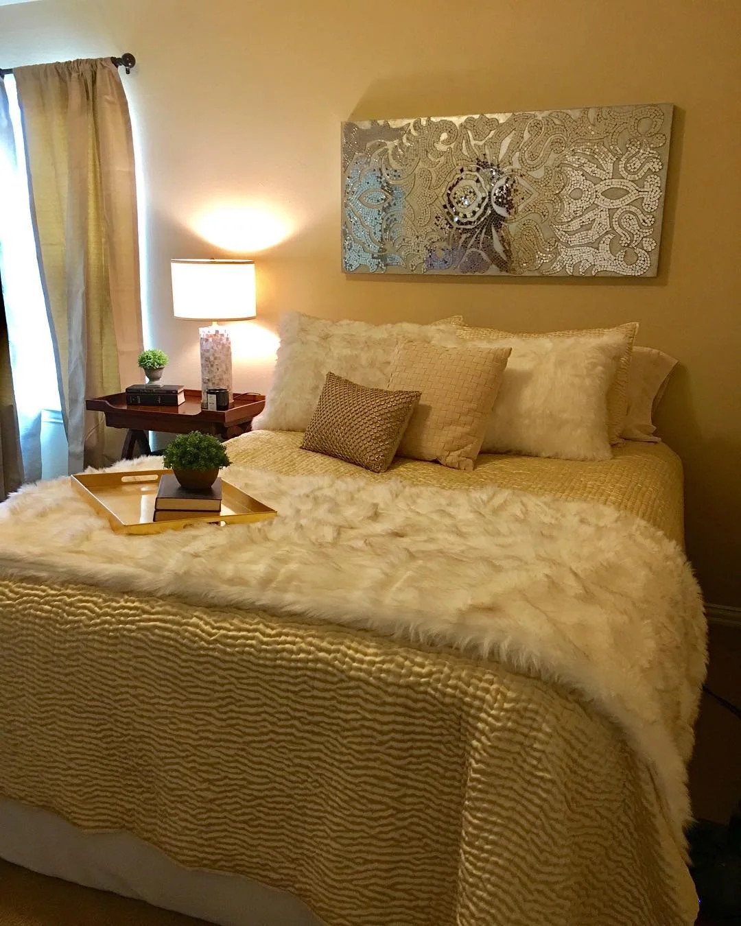 Glamorous Gold Bedroom with Mirrored Wall Art