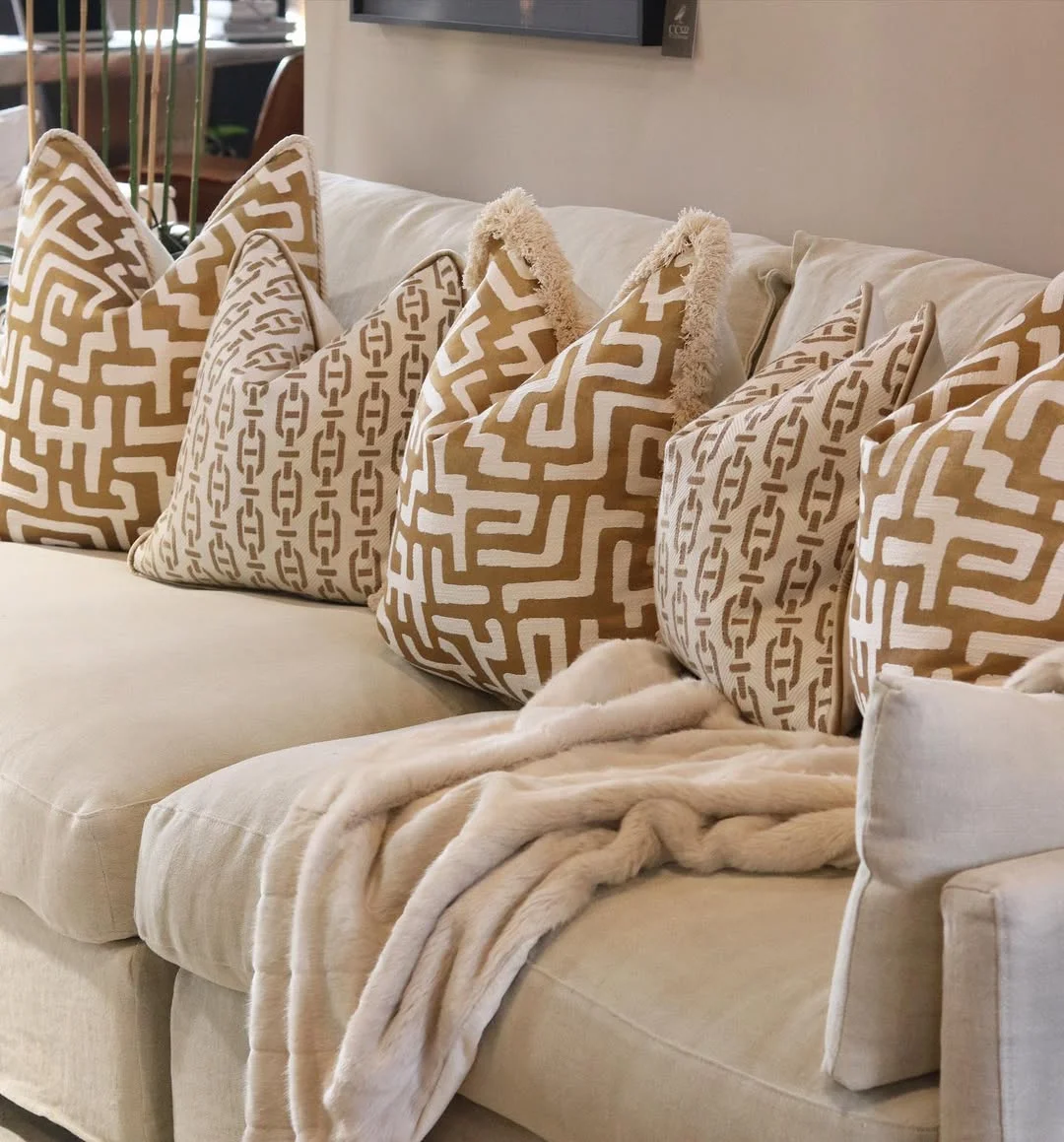 Neutral Sofa with Gold Patterned Pillows