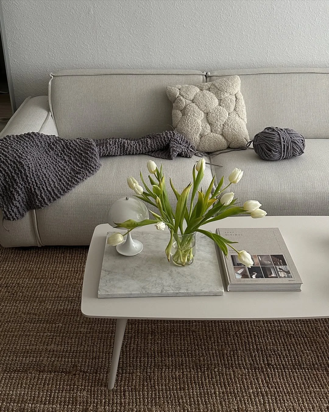 Minimalist Living Room with Neutral Tones and Fresh Tulips