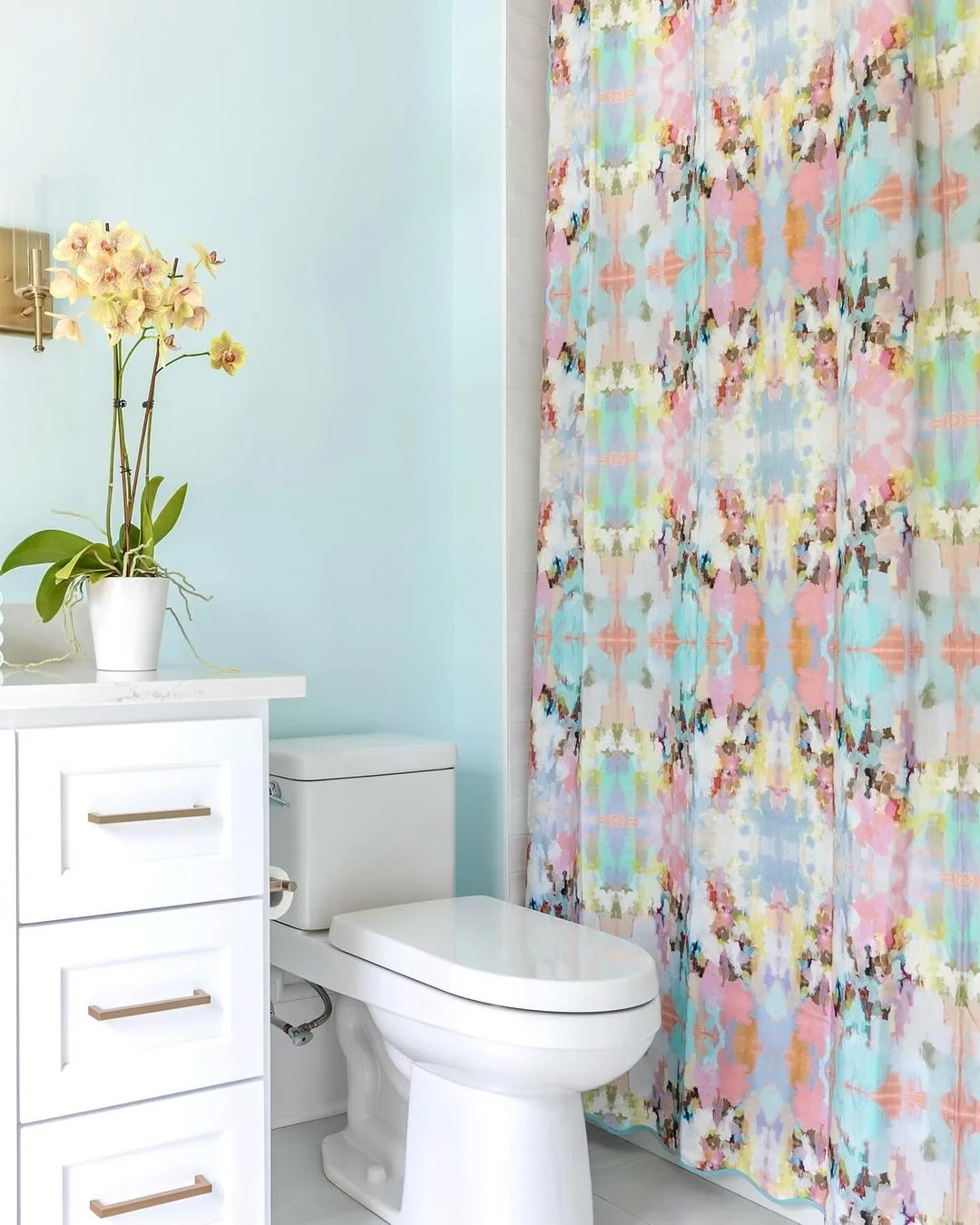 Watercolor Shower Curtain in a Light Blue Bathroom