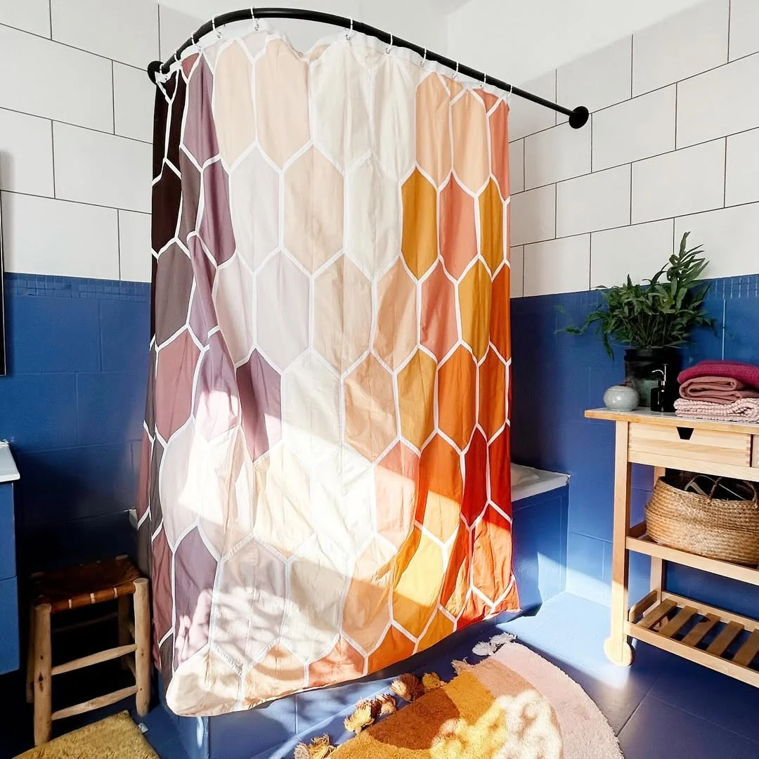 Honeycomb Shower Curtain in a Blue Bathroom