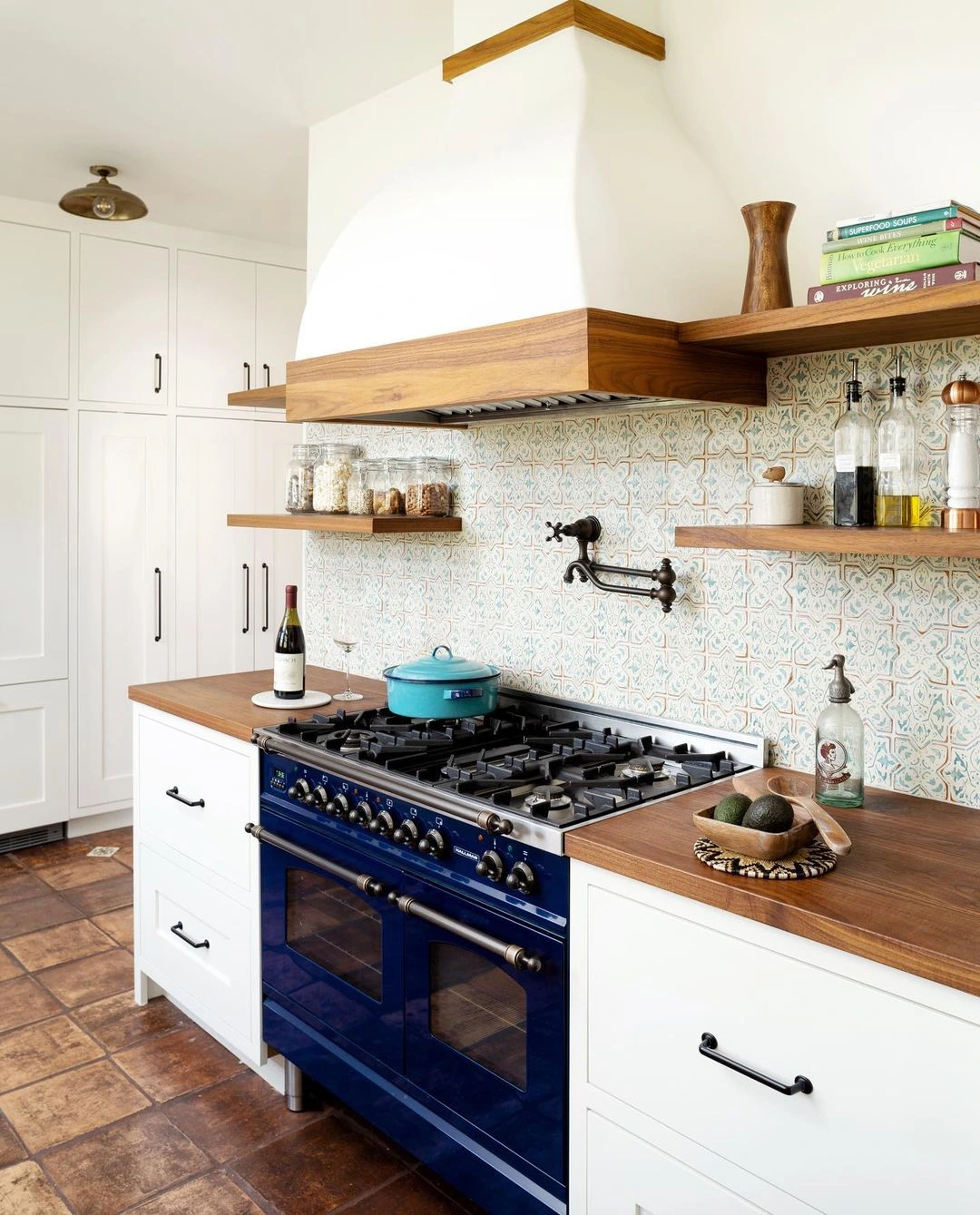 Navy and Terracotta Harmony in a Spanish Kitchen