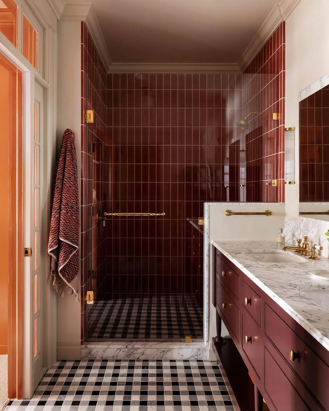 Deep Red Subway Tile Bathroom with Checkered Floor