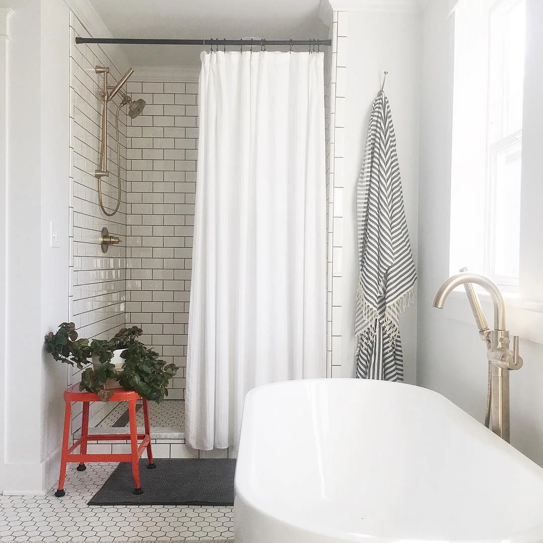 Bright and Airy Bathroom with Subway Tile Shower