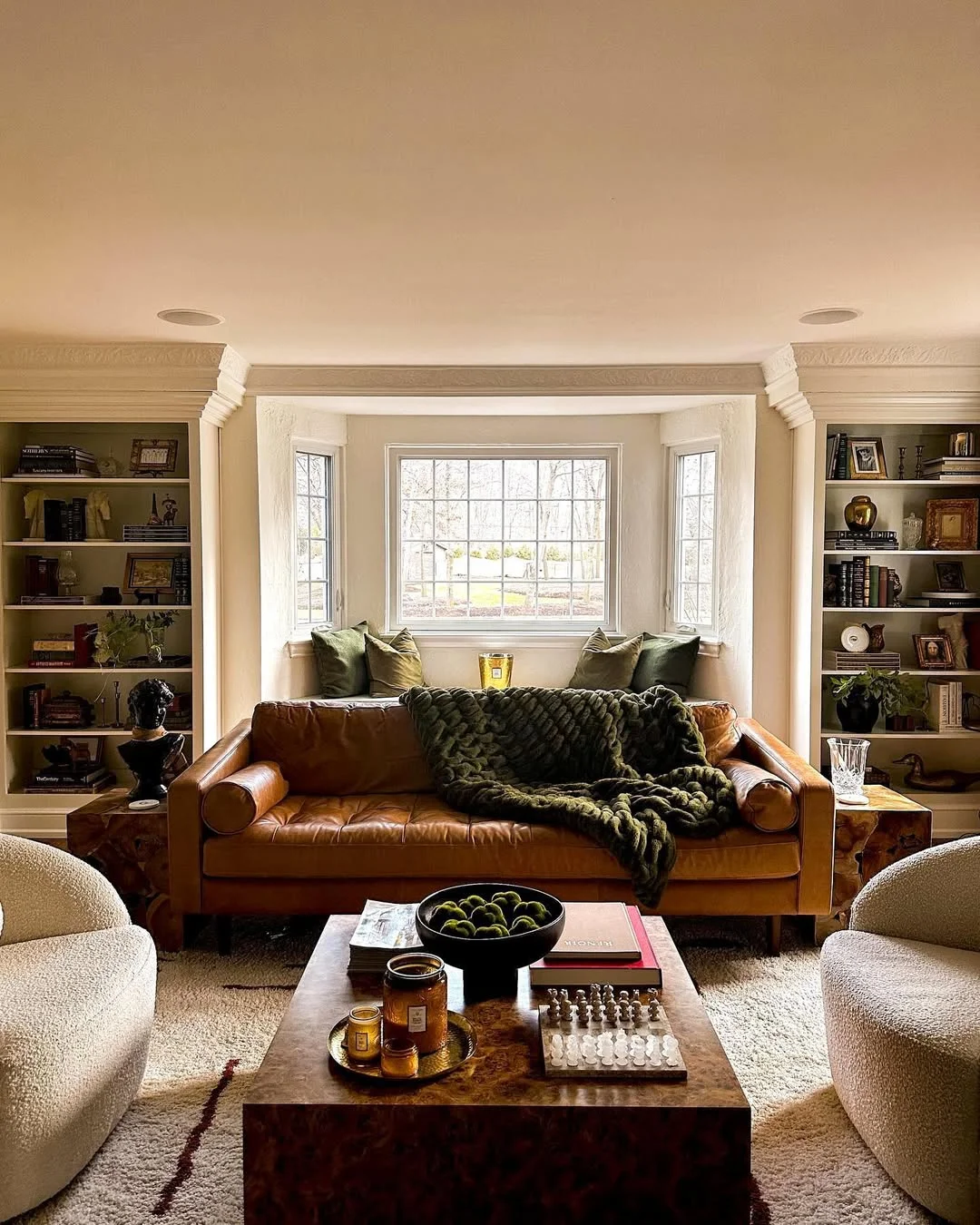 Traditional Living Room with Tan Leather Sofa and Built-in Bookcases