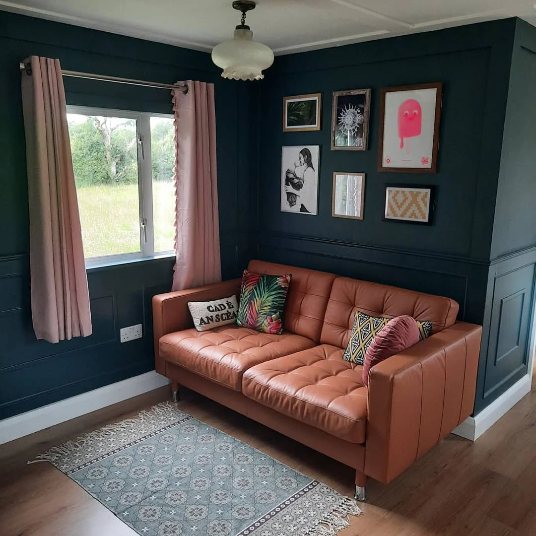 Chic Tan Leather Sofa in a Teal Living Room