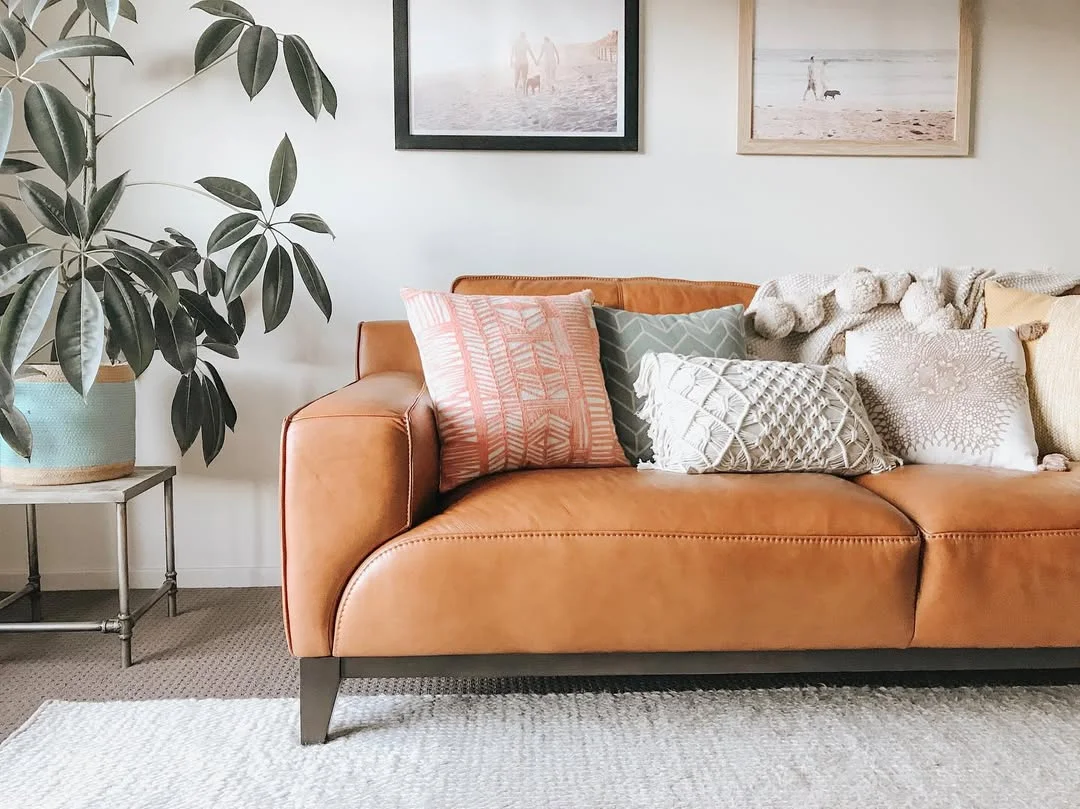 Tan Leather Sofa with Cozy Cushions