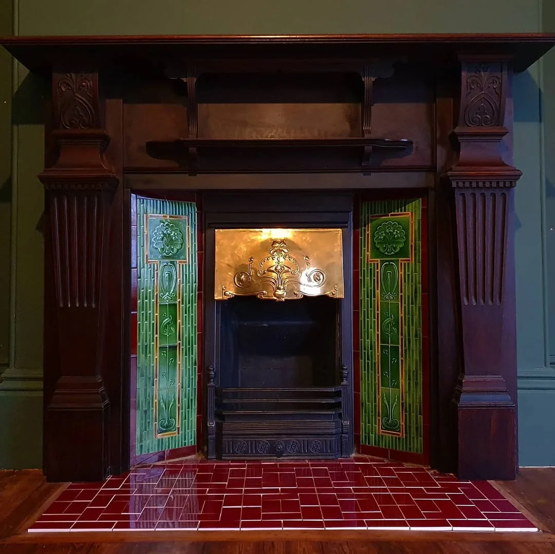 Antique Fireplace with Ornate Wood and Tile