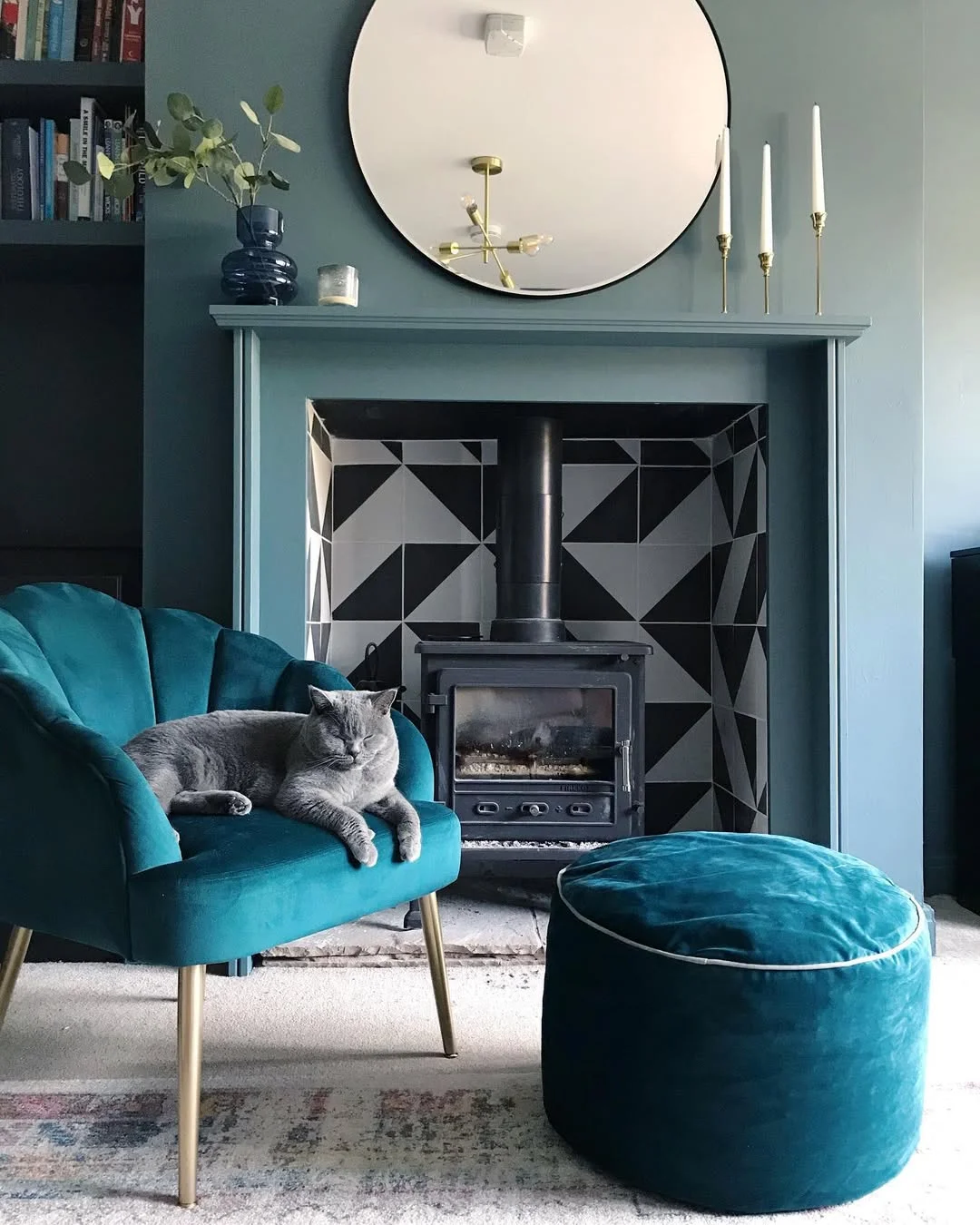 Stylish Teal Living Room with Geometric Fireplace